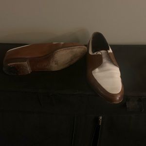 Brown and white lace Cole Haan shoes. Worn but still have a lot of life left.